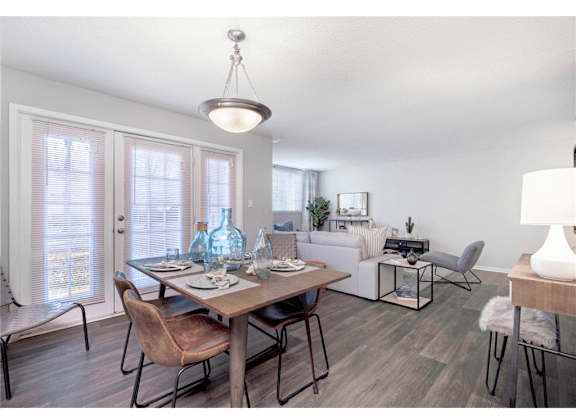 Spacious living and dining room at Springdale Glen, a pet-friendly community in Clarkston, GA, near Decatur.