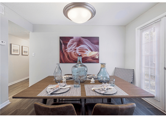 Dining room with a large window and abundant natural light at Springdale Glen, a pet-friendly community in Clarkston, GA, near Decatur.