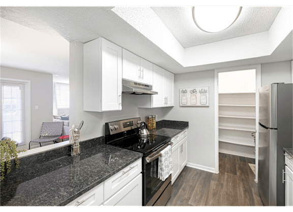 Spacious kitchen with a large pantry at Springdale Glen, a pet-friendly community in Clarkston, GA, near Decatur.
