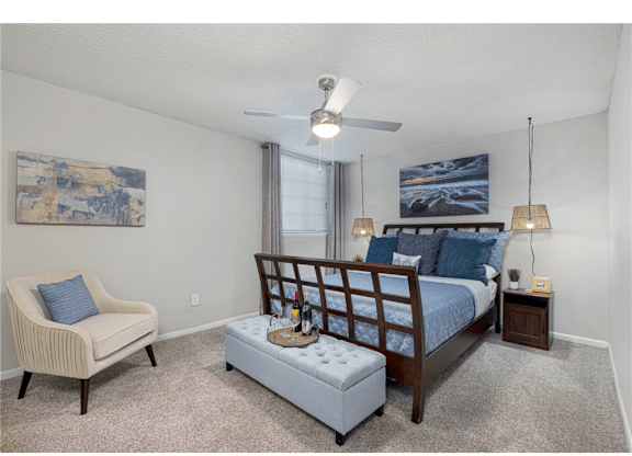 Bright bedroom featuring large windows at Springdale Glen, a pet-friendly community in Clarkston, GA, near Decatur.