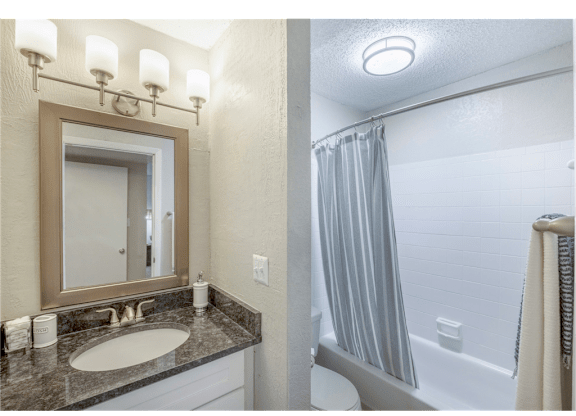 Bathroom featuring a combined shower and tub at Springdale Glen, a pet-friendly community in Clarkston, GA, near Decatur.