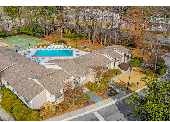 Aerial view of Springdale Glen community, showcasing the residential buildings and resort-style pool at this pet-friendly community in Clarkston, GA, near Decatur.