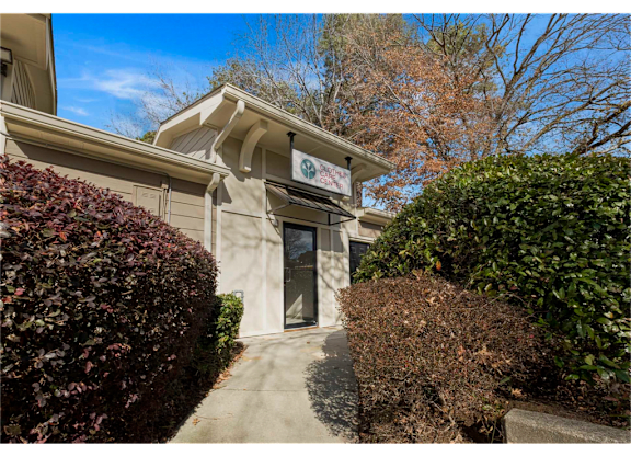Exterior of the clothes care center at Springdale Glen, a pet-friendly community in Clarkston, GA, near Decatur.