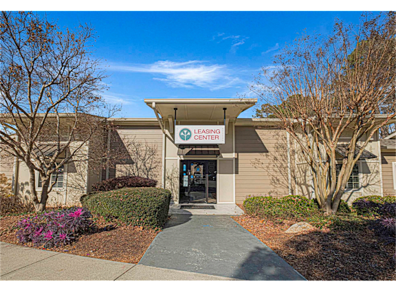 Exterior of the leasing office at Springdale Glen, a pet-friendly community in Clarkston, GA, near Decatur, featuring welcoming entrance and landscaped surroundings.