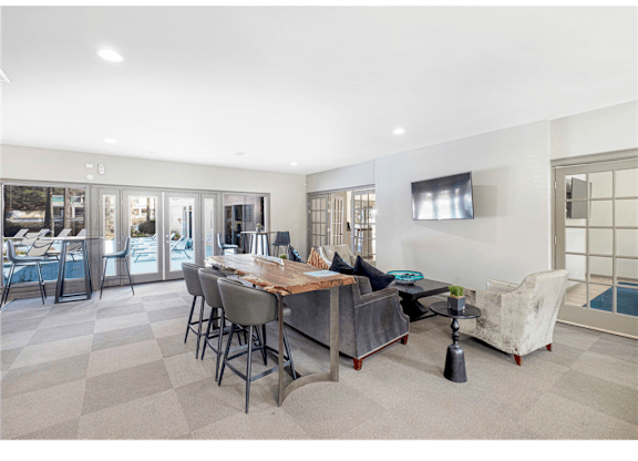 Spacious clubroom featuring cozy seating areas at Springdale Glen, a pet-friendly community in Clarkston, GA, near Decatur.
