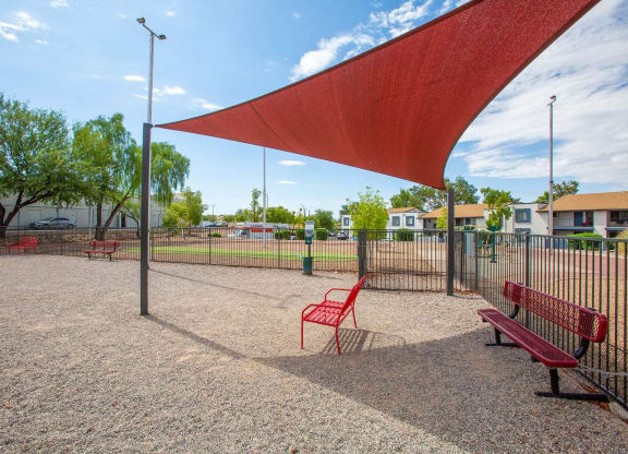 our apartments have a park with benches and a canopy