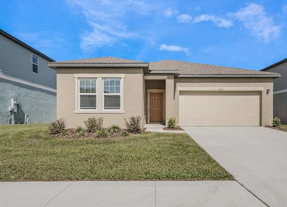 A house with a brown garage door and a brown front door.