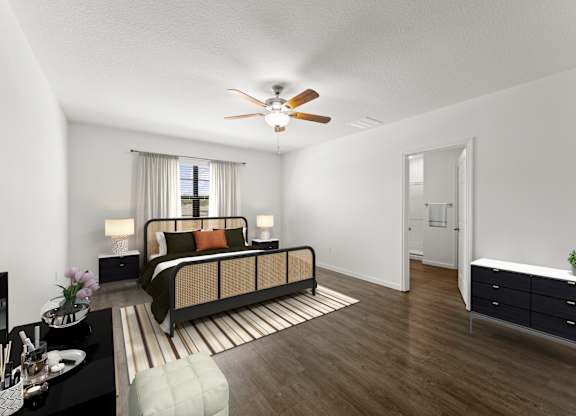 A bedroom with a bed, nightstand, and a dresser.