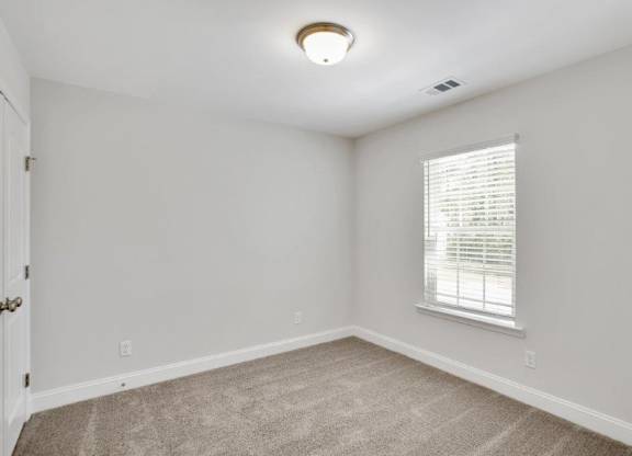 Harris Trail Luxury Townhomes for rent Richmond Hill, GA photo of bedroom with plush carpeting