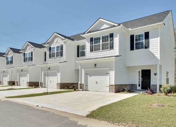 Harris Trail Luxury Townhomes for rent Richmond Hill, GA photo of townhomes with garages and driveways