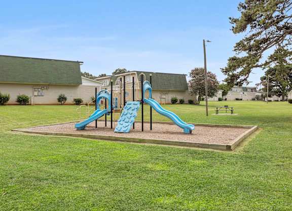 Community playground with safe play structures at Hunters Pointe apartments in Charlotte, NC 28213, near UNC Charlotte.
