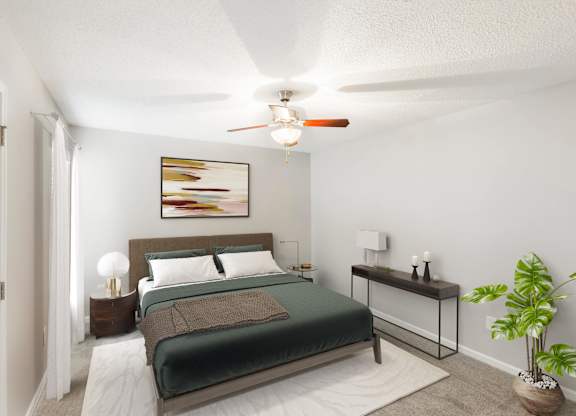 Spacious bedroom with natural light at Hunters Pointe apartments in Charlotte, NC 28213, near UNC Charlotte.