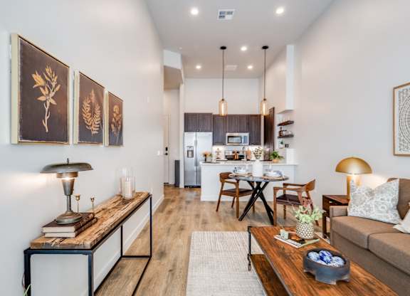 A modern living room with a wooden coffee table and a couch.