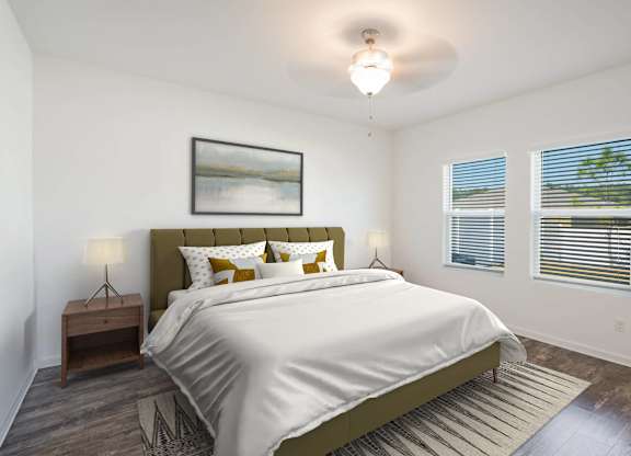 A bedroom with a large bed and a painting on the wall.