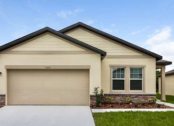 A beige house with a garage door that says 3509.