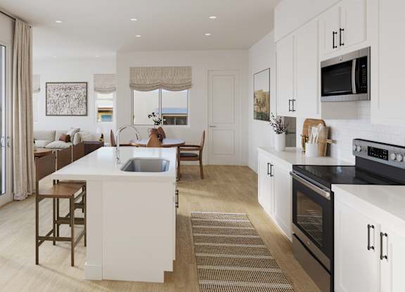 A modern kitchen with a bar stool and a dining table.