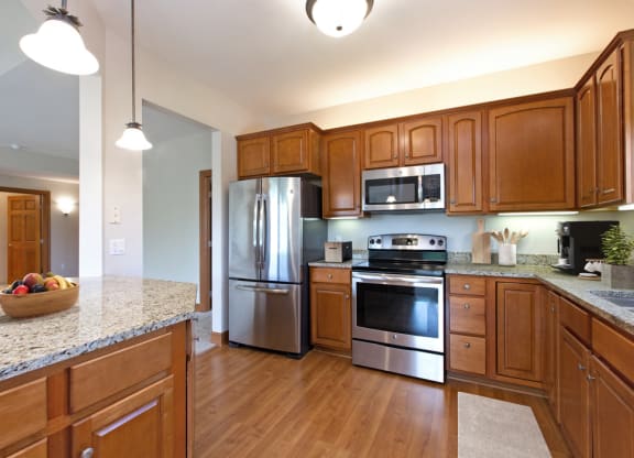 Laurel East End Apartments in Golden Valley, MN photo of a full kitchen with stainless steel appliances and granite counter tops