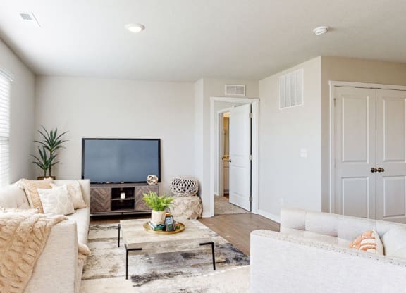 a living room with a couch and a tv