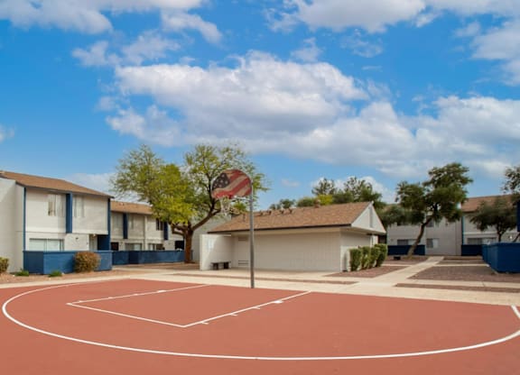 Full-sized basketball court at Midtown on Seneca, a pet-friendly apartment community near East Central Tucson, Tucson, AZ.
