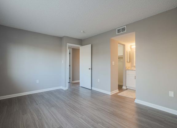 A room with a doorway leading to another room.