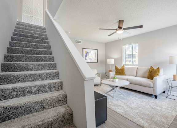 Kissimmee, Florida Apartments - Mirador at Woodside - Living Room Area with Staircase to Upstairs