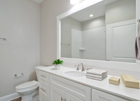 Bathroom at Mirador at Peachtree in Atlanta, Georgia, near Briarcliff, featuring a single vanity and large mirror