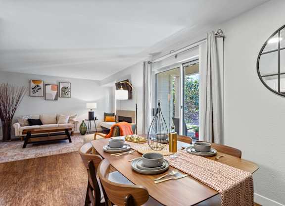 A dining room with a wooden table set for two at MonteVista Apartments, Oregon