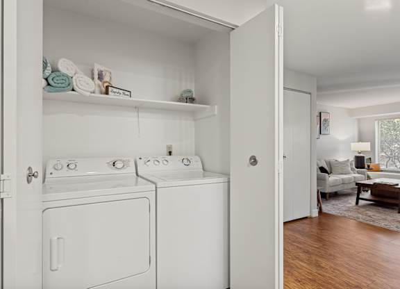 A white laundry room with a washer and dryer at MonteVista Apartments, Beaverton, OR 97007