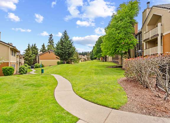 A residential area with a pathway and houses at MonteVista Apartments, Beaverton, OR
