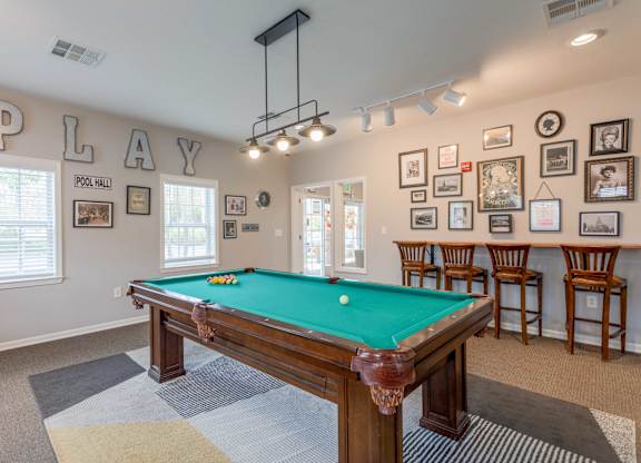 Apartments in Sevierville for Rent – Overlook at Allensville -   A pool table in a room with a sign that says "PLAY".