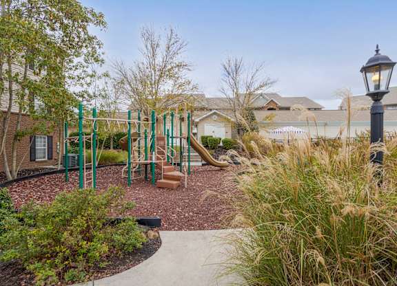 Apartments in Sevierville for Rent – Overlook at Allensville -   A playground with a swing set and a slide.