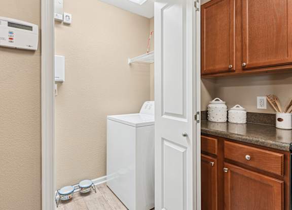 Pet-Friendly Rentals in Sevierville, TN – Overlook at Allensville – A small kitchen with a white fridge and a white door.