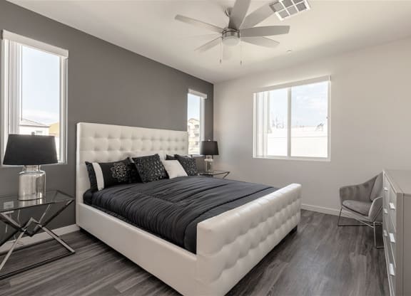 Primary bedroom with upholstered bed in Centennial North Las Vegas rental home