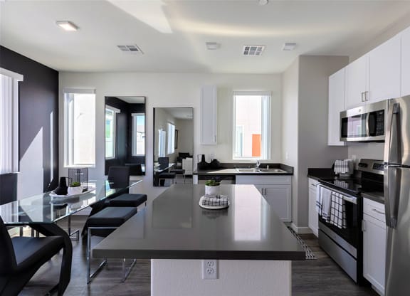 Open kitchen with island in 3 bedroom home for rent in Centennial area