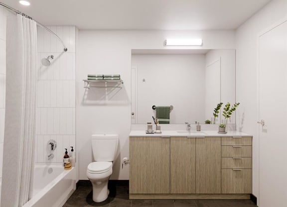 a bathroom with a toilet sink and bathtub