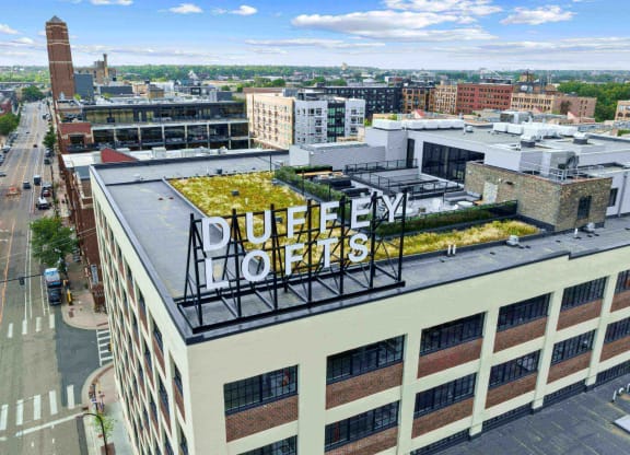 an aerial view of a building with a green roof