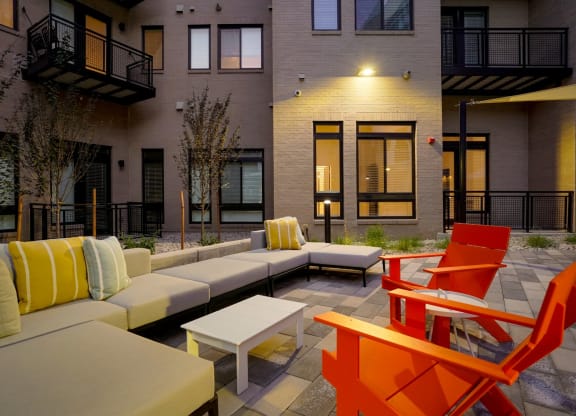 an outdoor lounge space at The Parallel apartments