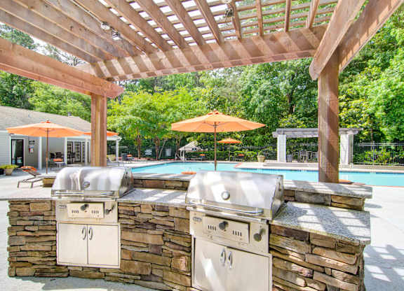 Outdoor BBQ grill area at Place at Midway apartments in Douglasville near Lithia Springs, GA