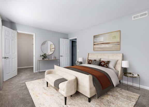 Reserve at Providence Apartment in Charlotte NC photo of a bedroom with a bed and a chair