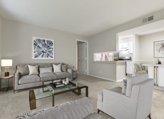 the timbers raleigh nc apartments for rent living room with sofa and chair and modern furnishings placed next to kitchen and dining area