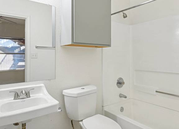 Bathroom with tub and shower at Huntington Meadows Apartments in Austin, TX 78724, featuring modern fixtures in apartments near East Austin.