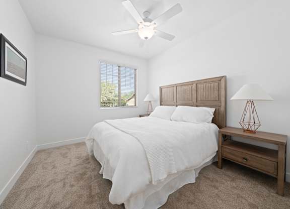 Townhomes in Surprise, AZ with In-Unit Washer and Dryer - Sierra Verde - Bedroom with Plush Carpeting, Double Nightstands, and Wall Art