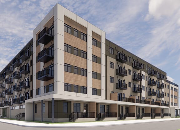 A modern apartment building with balconies on each floor.
