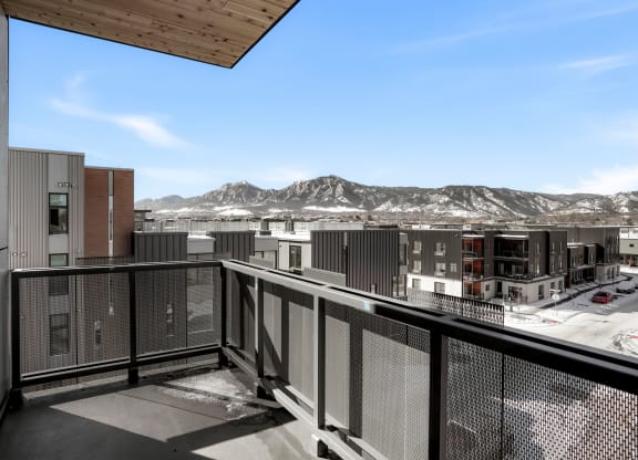 a balcony with a view of a mountain