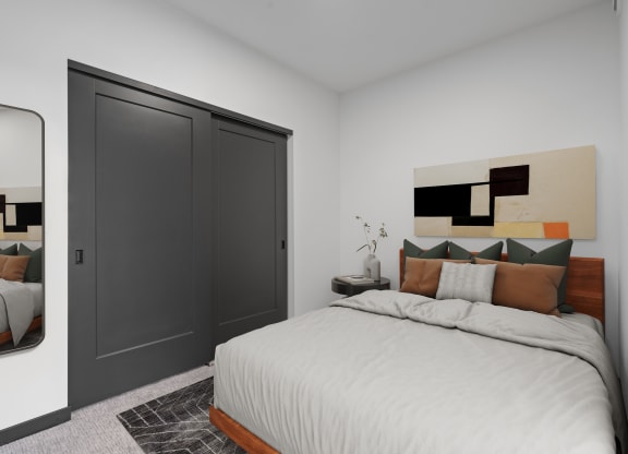 a bedroom with a large bed and a closet