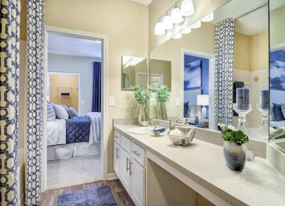 Spacious bathroom with long countertop at Grande Club apartments in Duluth, GA 30096, near Lawrenceville.