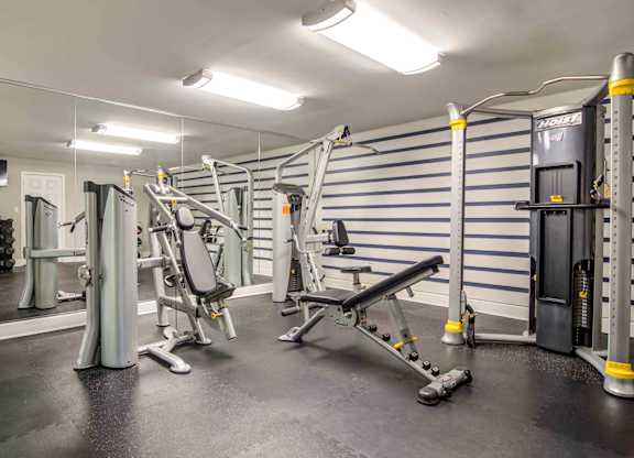 On-site fitness room with cardio machines, strength equipment, and free weights at pet-friendly Stratford Ridge Apartments in Marietta, GA—offering a convenient workout option for residents.