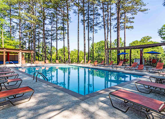 Pool with lounge chairs at Stratford Ridge, a pet-friendly community in Marietta, GA, near Smyrna.