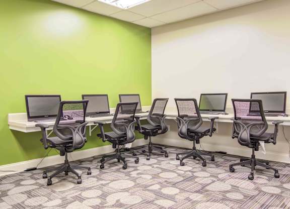 On-site business center with computers, printer access, and workspace at Stratford Ridge Apartments in Marietta, GA—ideal for remote work and study.