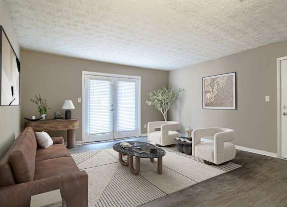 Spacious living room with sleek wood-style plank flooring at Stratford Ridge, a pet-friendly community in Marietta, GA, near Smyrna.